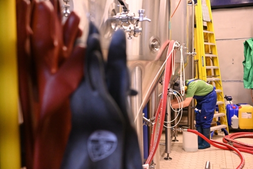 Cleaning the fermentation tank ready for the first batch.